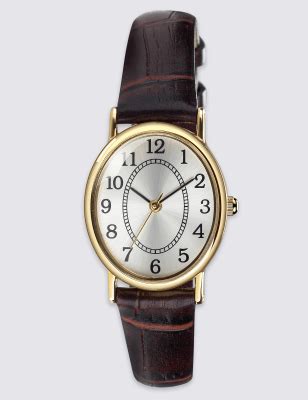 chanel watch oval face and black leather band